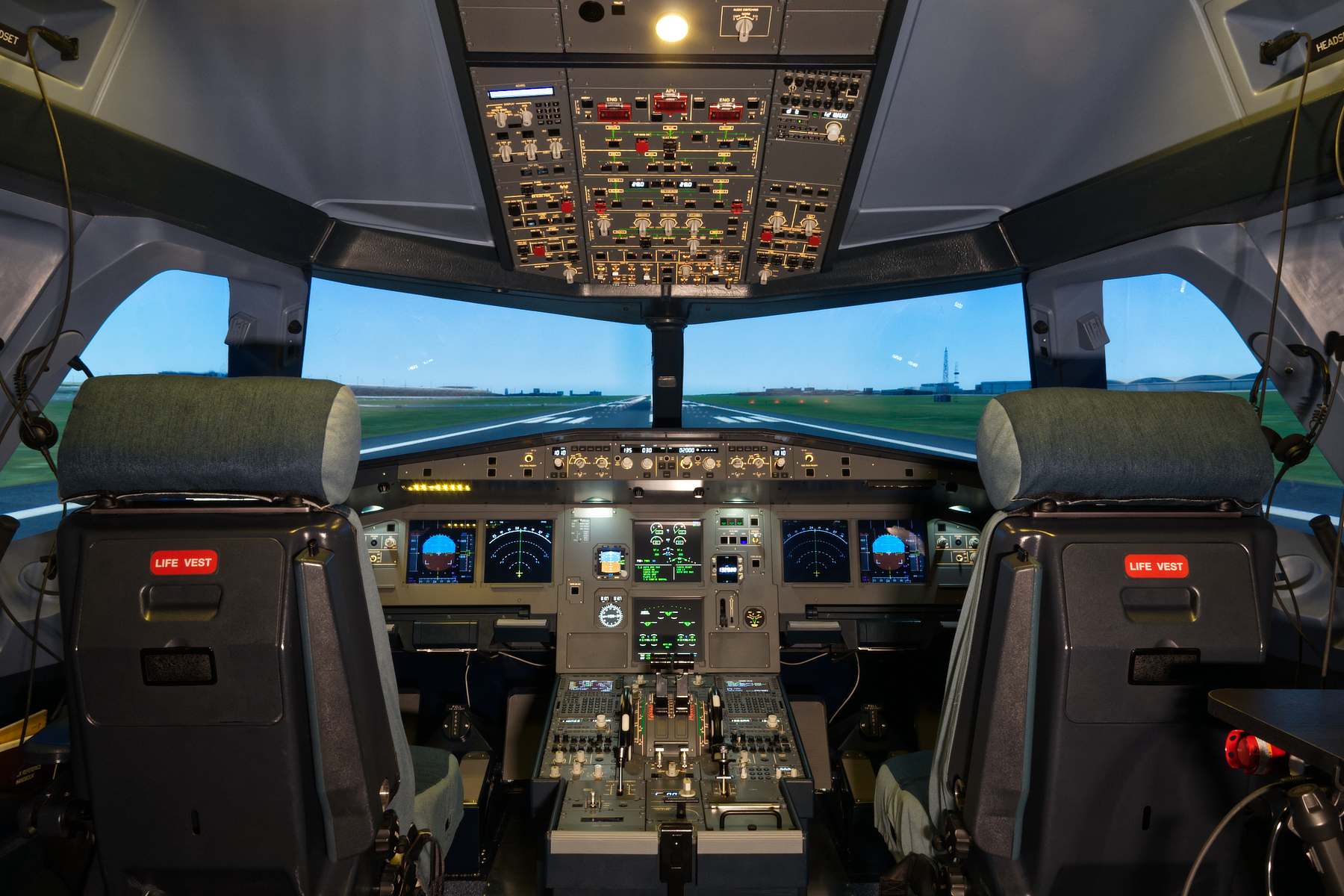 Airbus A320 fixed-base flight simulator cockpit with EFIS and ECAM displays and wide-angle visual system